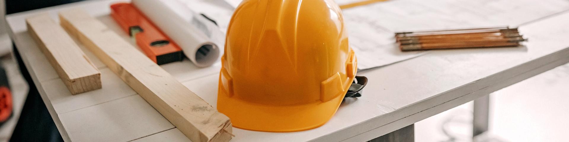 Photo of yellow hard hat on a table