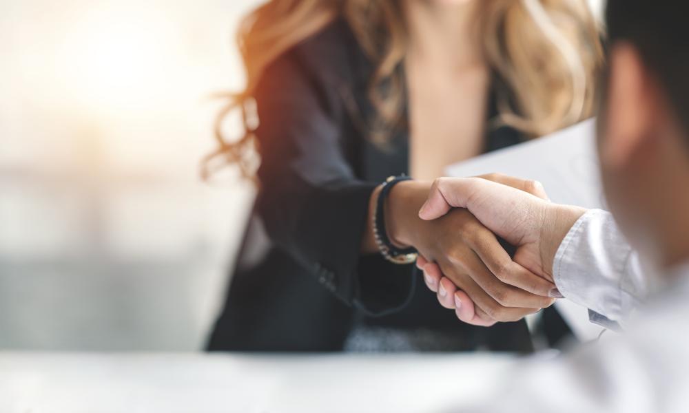 two people shaking hands